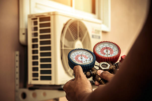Professional Air Conditioning Service technician working in Damascus, OR